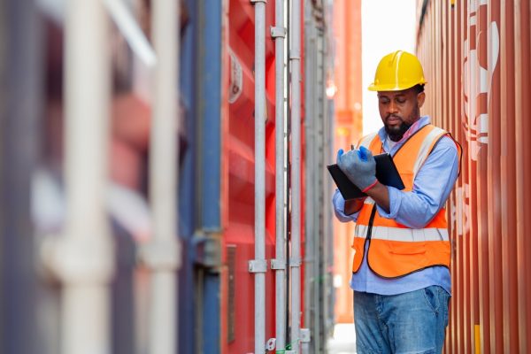 Worker Working At Container Yard. Logistics Supply Chain