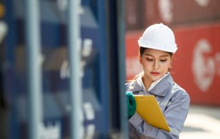 Customs Clearance Officer Checking The Imported Cargo